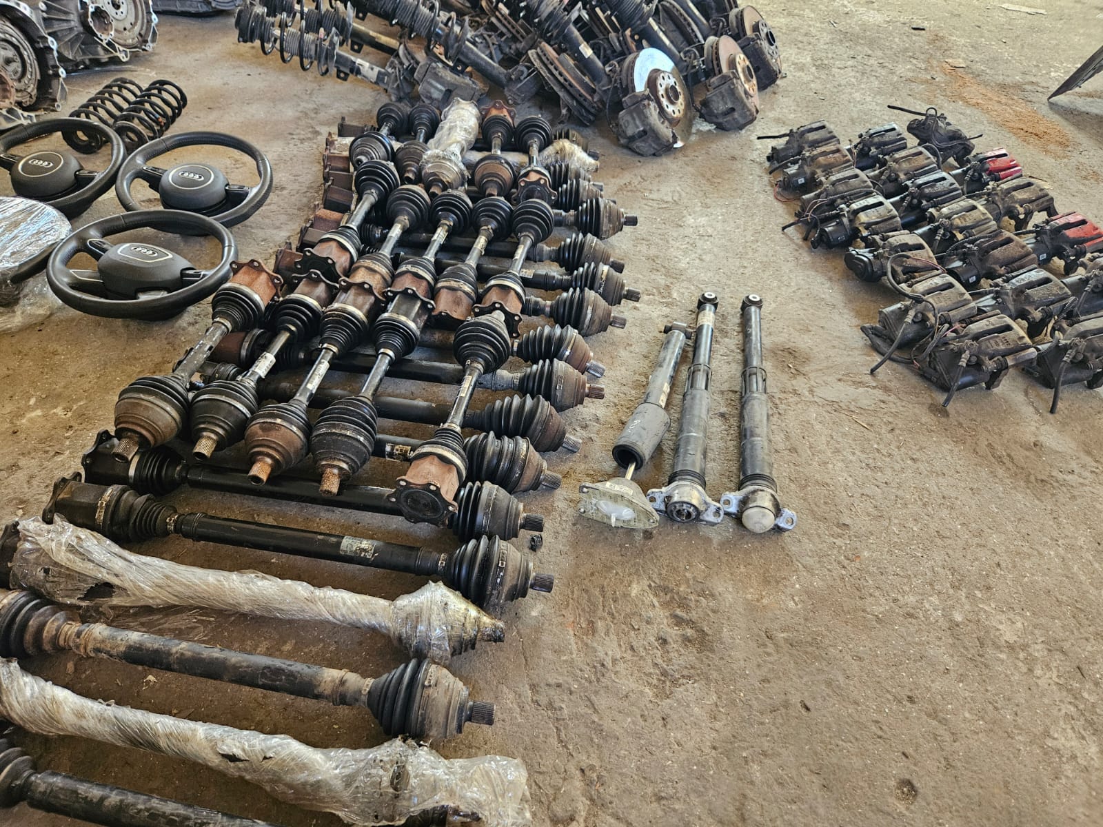 Auto parts warehouse with rows of engines and components