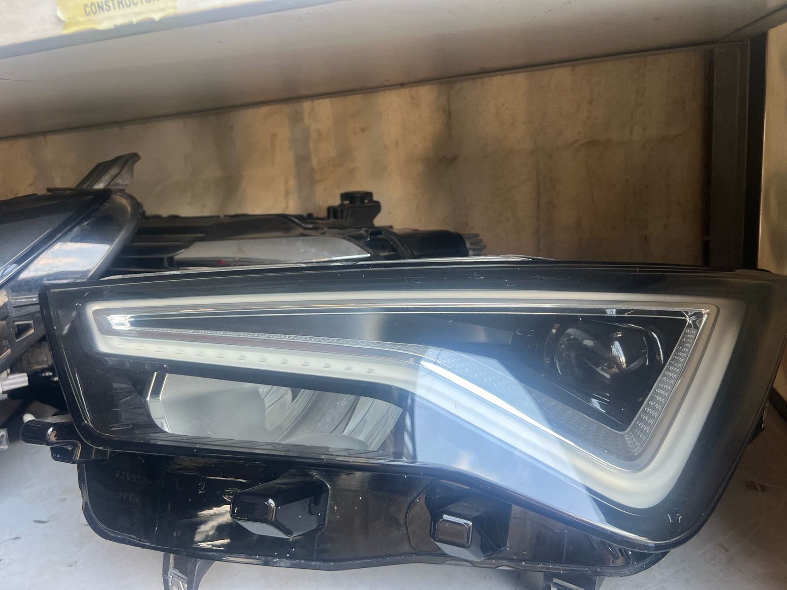 Audi Matrix LED headlight unit on warehouse shelf